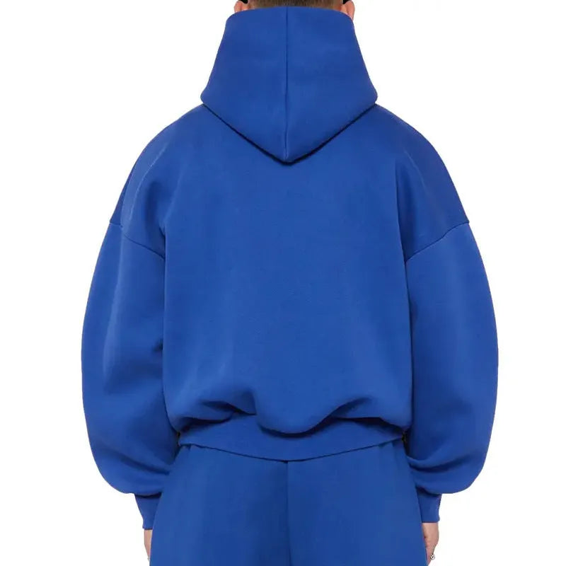 Man wearing a solid colour fleece-lined cotton pullover hoodie with a wool lining.