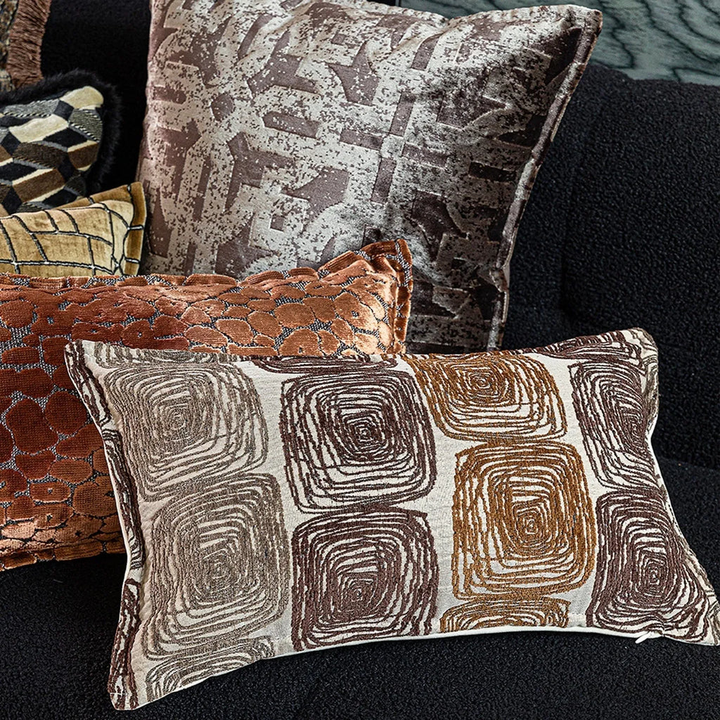 Cream and coffee abstract coil pattern square pillow cover made from polyester feather velvet.