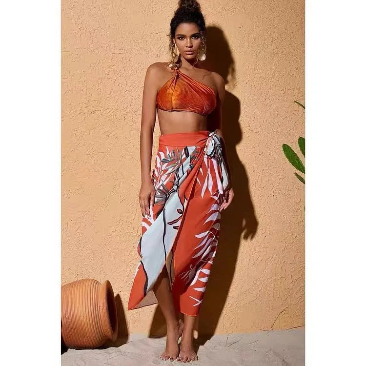 Brown high waisted push up bikini with a sheer split chiffon dress overlay on a mannequin.