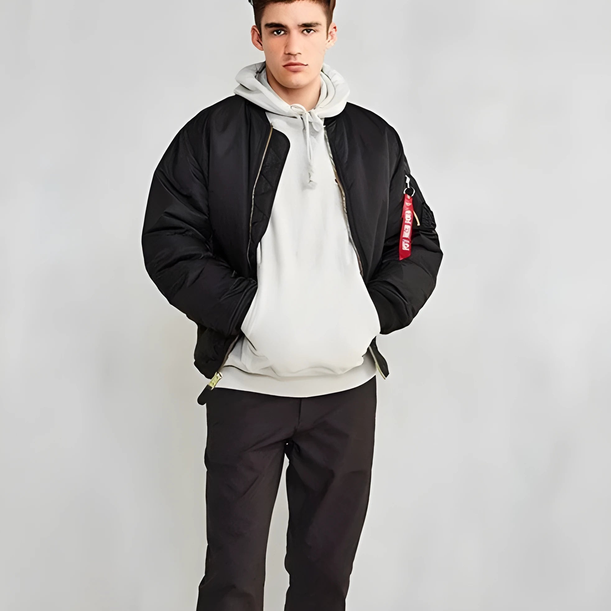 Men's army green American workwear style cotton-padded nylon jacket with a loose fit on a hanger.