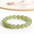 Polished Hetian jade ball bracelet showing ice-like clear beads in deep and light water variations