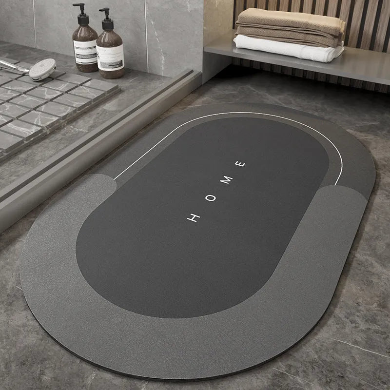 Blue oval blended fabric bathroom floor mat placed on tiled floor.