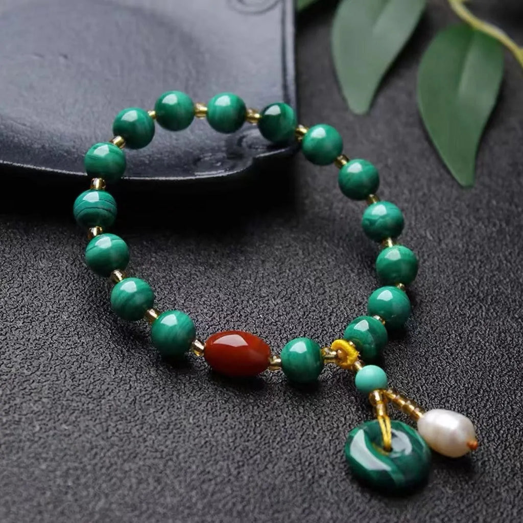 Natural malachite and southern red agate bracelet with 7-8mm round barrel beads on wrist