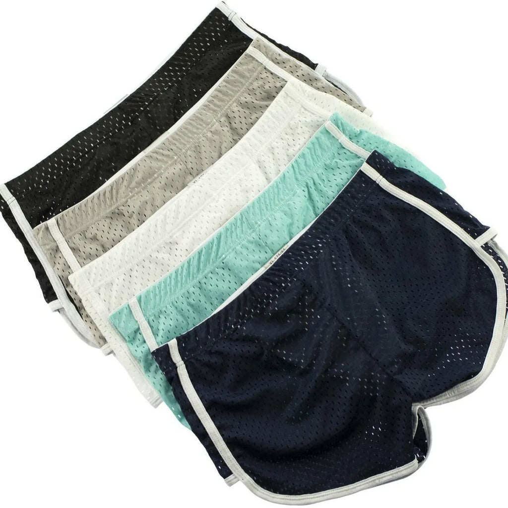Men's grey three-point cotton boxer shorts laid flat, showing mid-waist and knitted fabric.