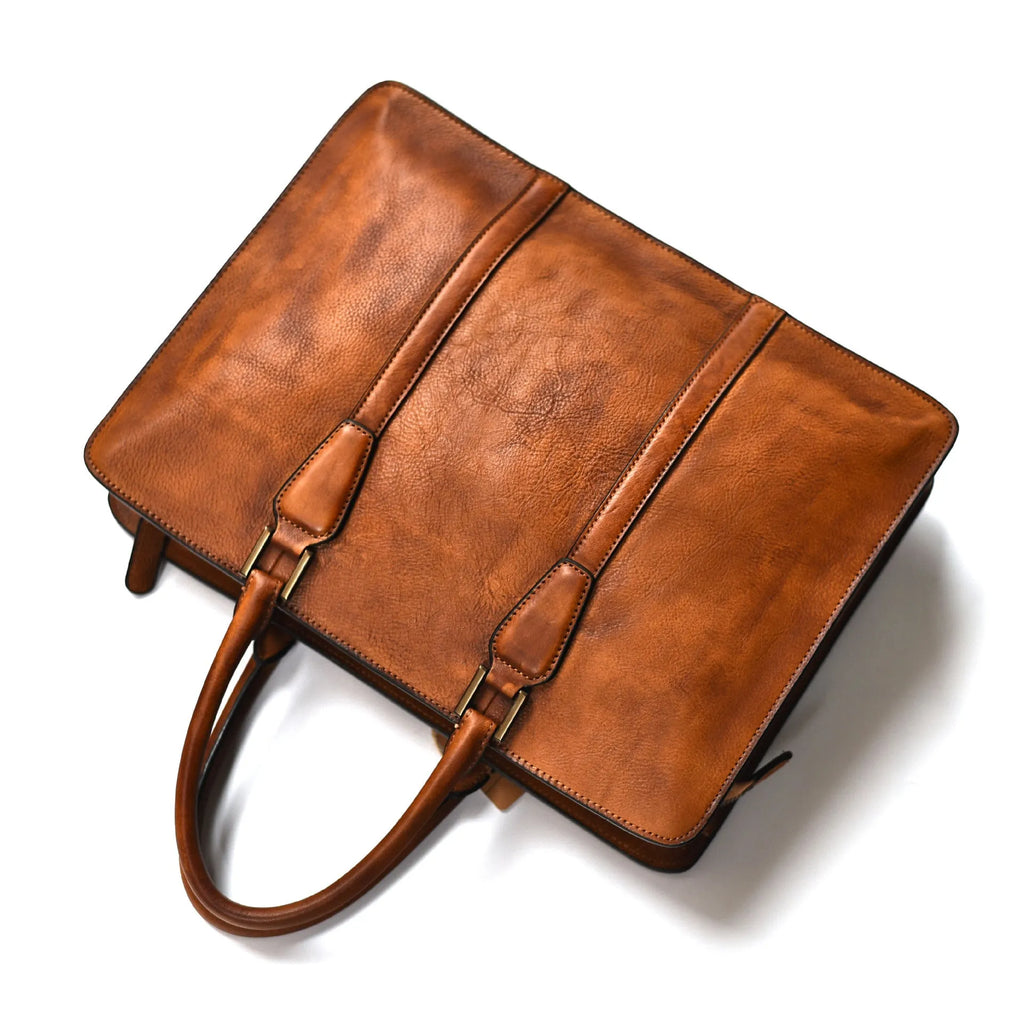 Men's brown leather business handbag with square horizontal shape and top zipper opening