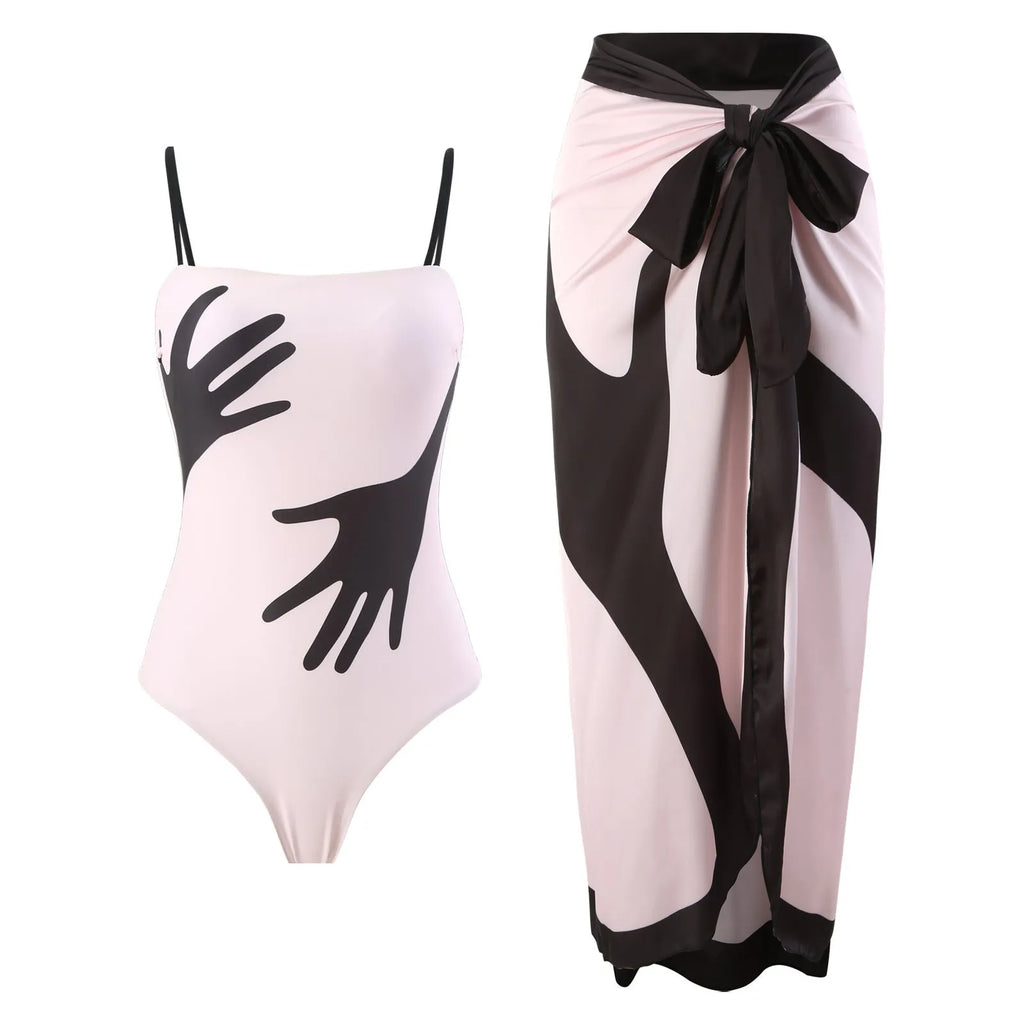 Women's patterned one-piece bikini two-piece set with a light grey tulle skirt attached.