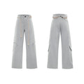 Man wearing dark grey straight-leg cotton trousers with a tassel detail and loose fit.