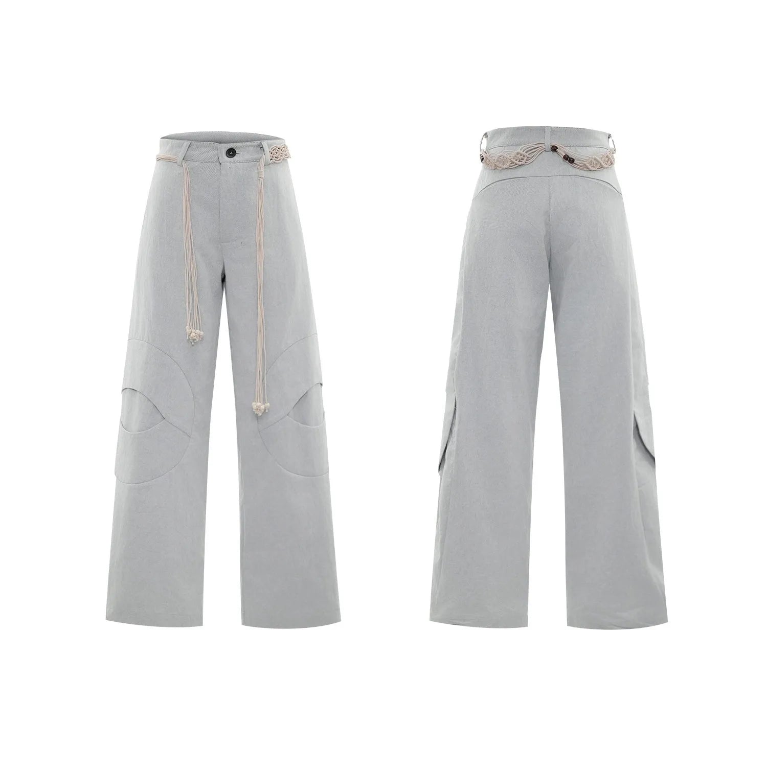 Man wearing dark grey straight-leg cotton trousers with a tassel detail and loose fit.