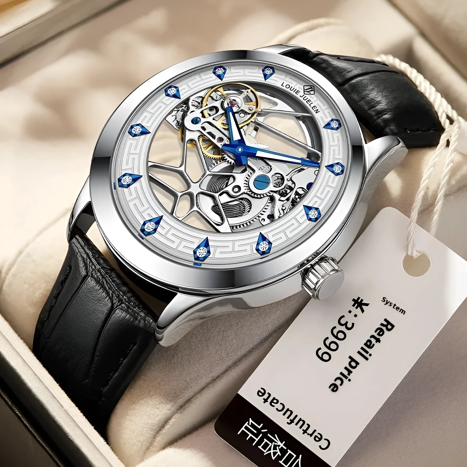 Men's silver mechanical watch with white dial, blue hands, black leather strap, and stainless steel buckle