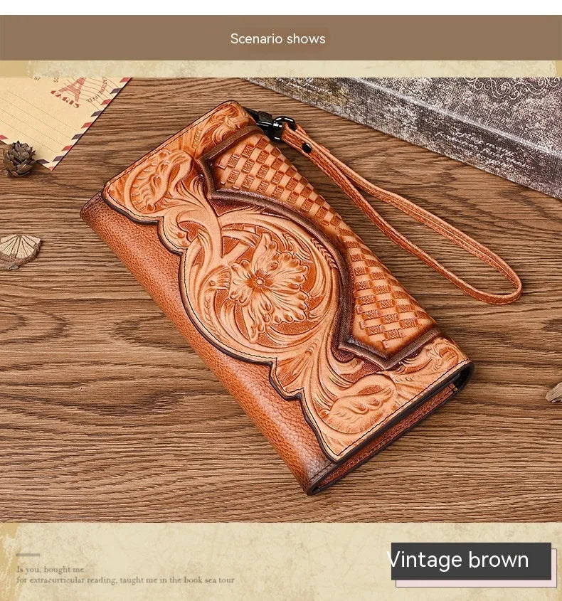 Women's brown tri-fold leather wallet with embossed floral pattern showing interior card slots