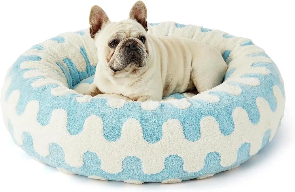 Round plaid dog bed with a plastic base in sea blue and white colour.