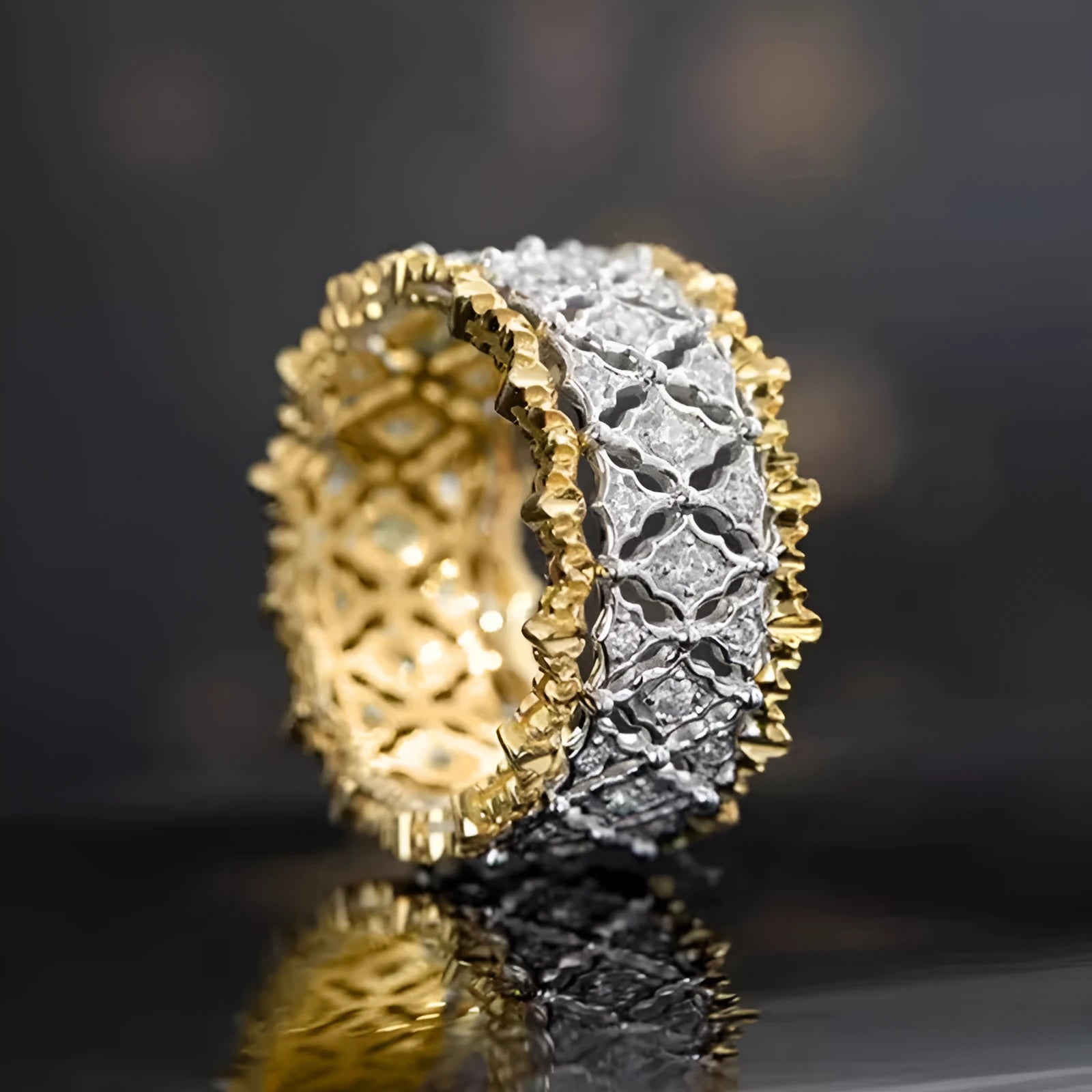 Geometric two-tone zircon ring in gold and silver on copper, showing round stone and available in sizes 6-10.