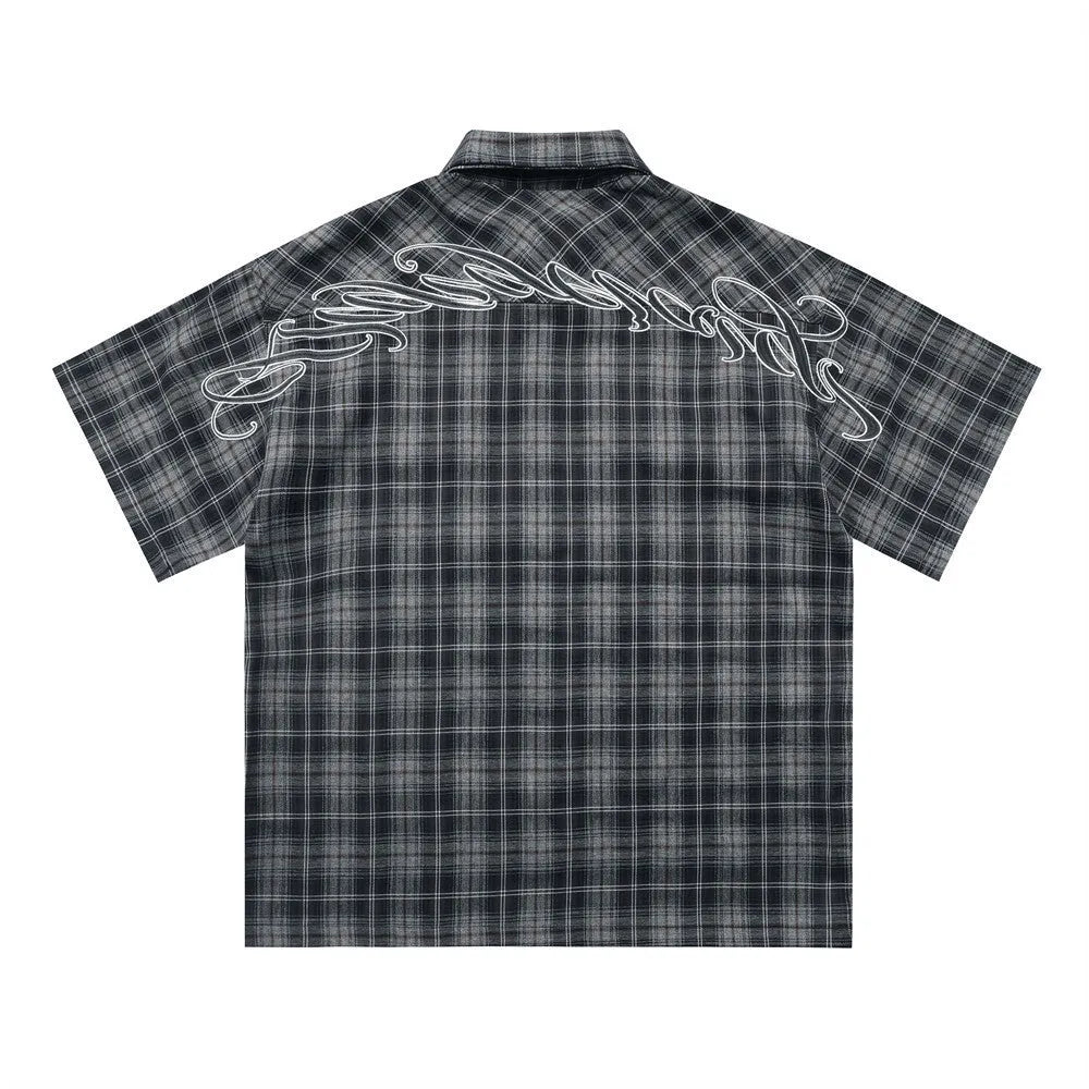 Men's black and brown plaid shirt with embroidered letter detail and lapel collar