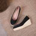 Women's apricot wedge heel pumps with rope detail on heel and round toe.