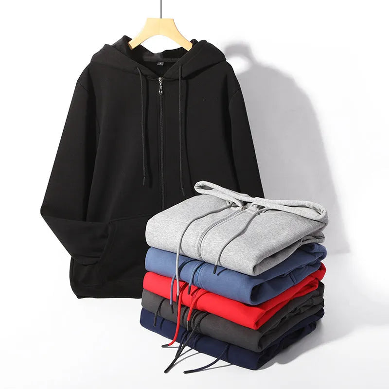 Man wearing a beige loose fit zip-up hooded cardigan with top-stitching pockets.