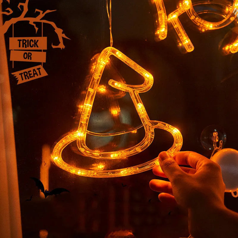 Halloween battery-powered LED window lights with suction cups showing spider, pumpkin and ghost designs