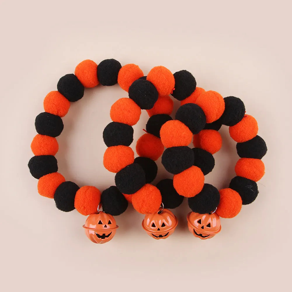 Orange and black Halloween pumpkin design on an adjustable cat collar for trick-or-treat.