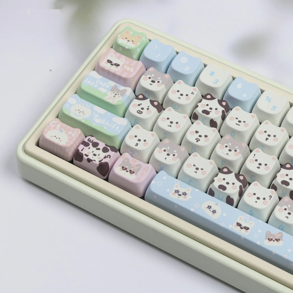 PBT sublimation keycap set showing detailed puppy and cat designs on mechanical keyboard keys