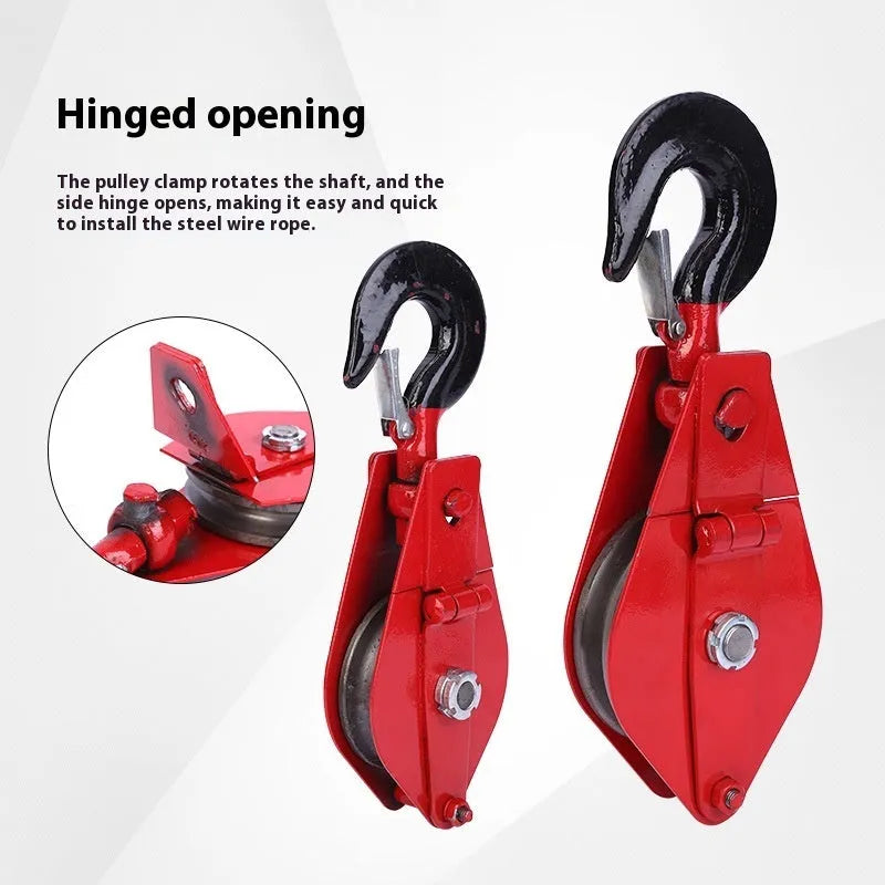 A small red industrial lifting pulley with a forged steel hook and safety latch.