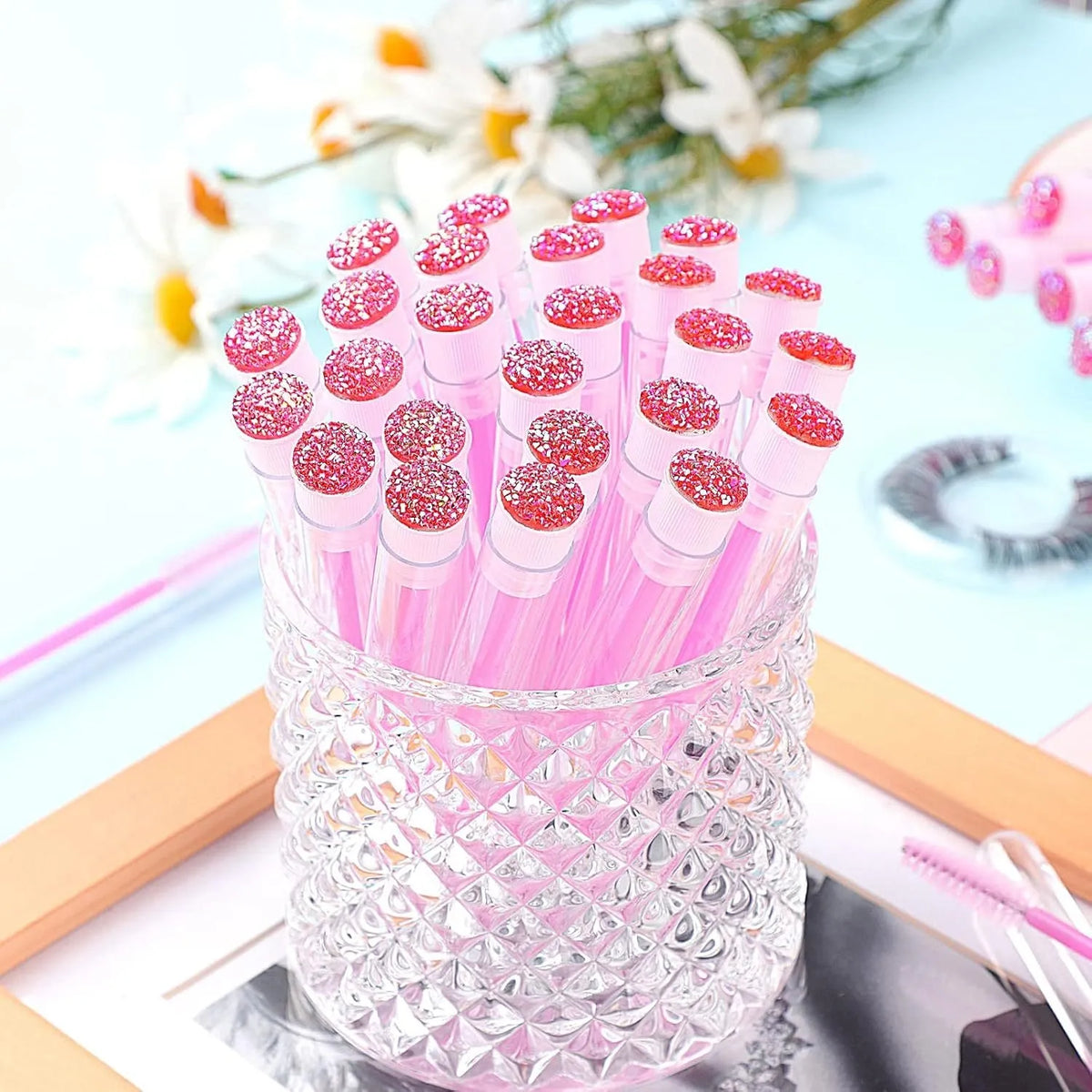 Disposable eyelash brushes in four colours with transparent storage tubes for mascara and extension work