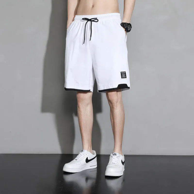 Cotton shorts for teenage boys in black, khaki, and white, showing mid-waist fit and shorts length.