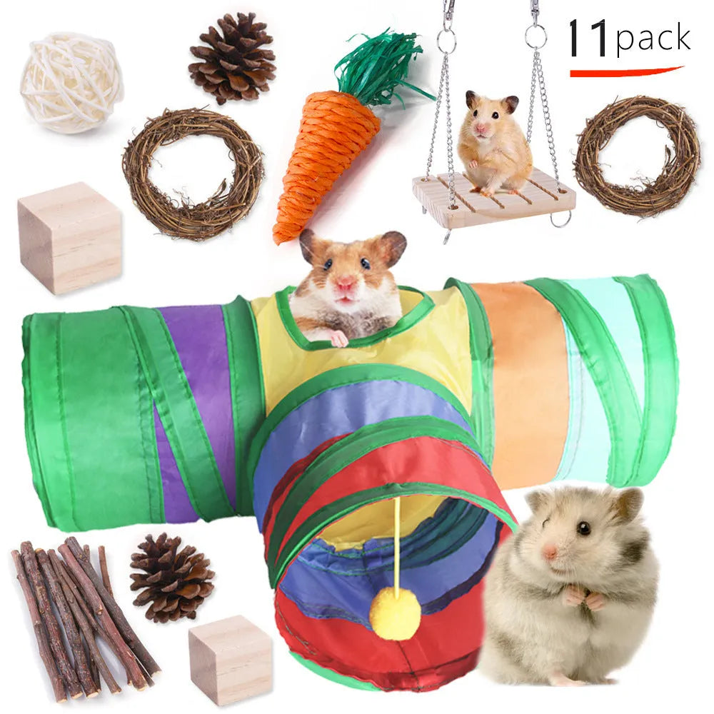 Assorted natural wooden and woven plant chew toys for rabbits, guinea pigs, and parrots on a straw mat.