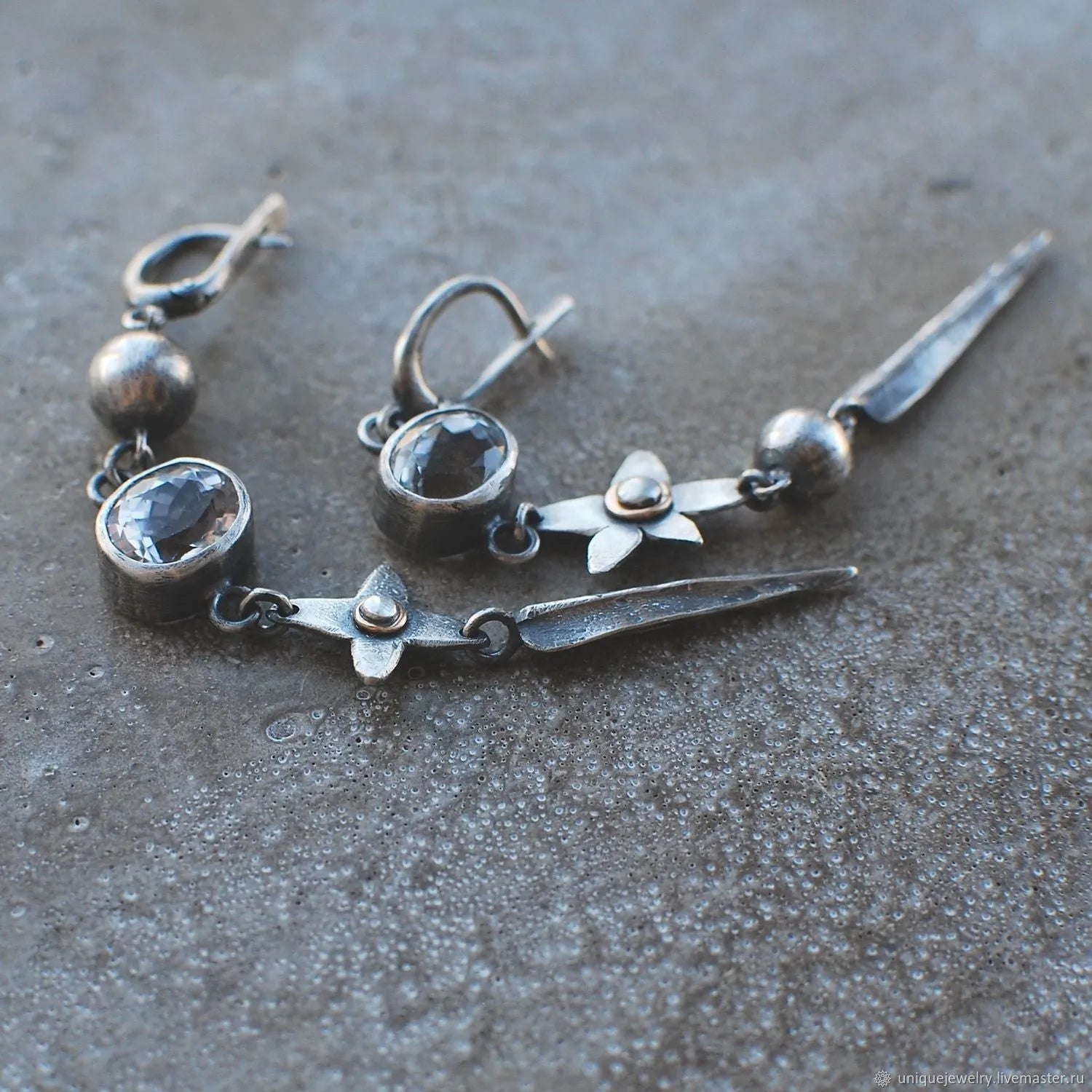 Geometric pendant earrings with antique silver plating and rhinestone detailing