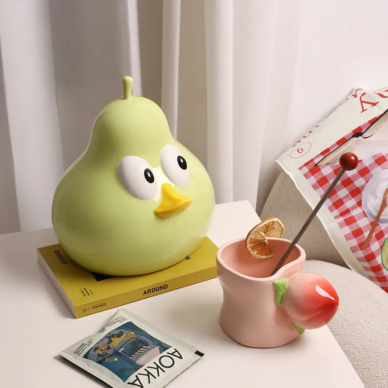 Ceramic pear-shaped tissue box with animal decoration in black or green colour