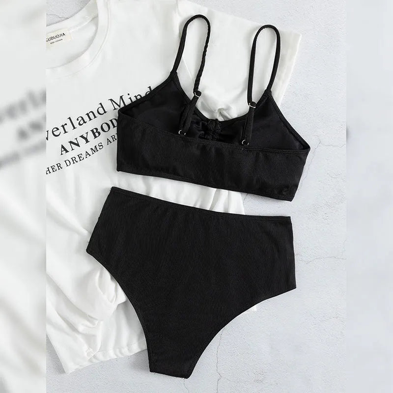 Black women's bikini swimsuit with sling split high waist design and matching shorts
