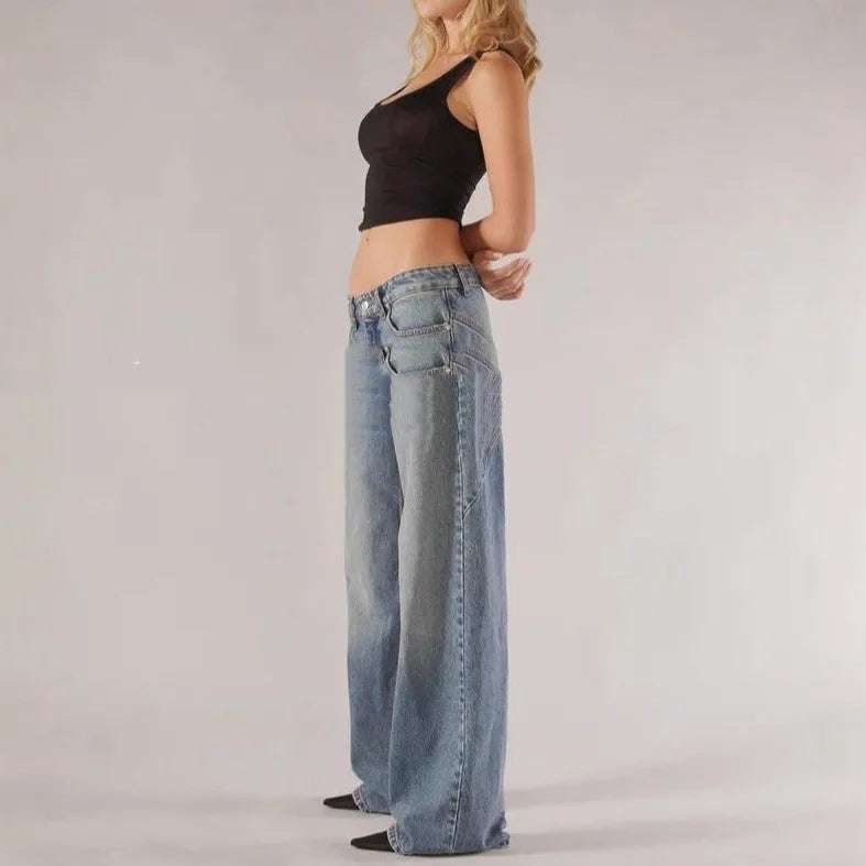 Women's loose blue cotton wide-leg mop trousers with low waist and spliced panelling on a mannequin.