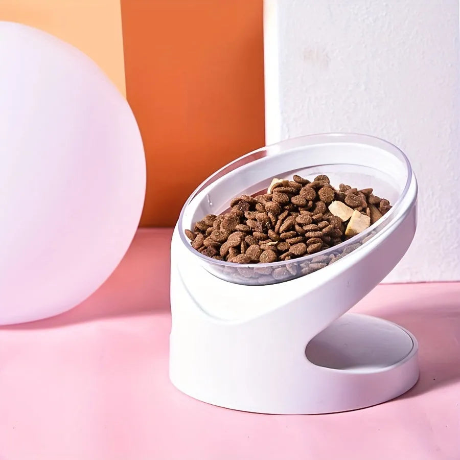 White clear elevated plastic cat food bowl with anti-vomit tilt design.