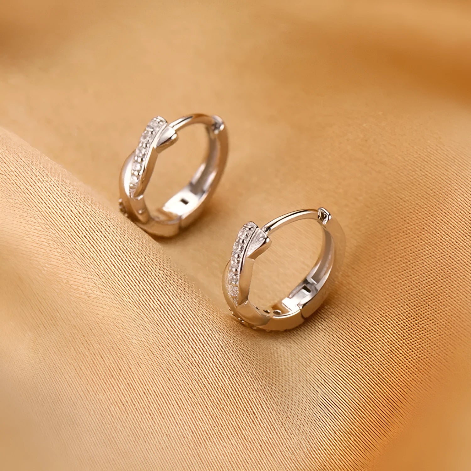 Geometric interwoven hemp rope earrings in gold or silver colour with copper construction