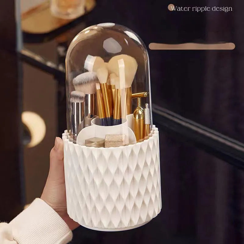 White transparent acrylic makeup brush holder with lid on a desktop, showing rotating base.