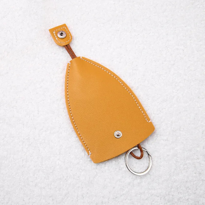 Cartoon PU leather pull-out car key case measuring 14 x 7.5cm with colourful designs