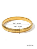 Women's gold titanium steel bracelet with exaggerated vertical stripe ring pattern and elastic band.