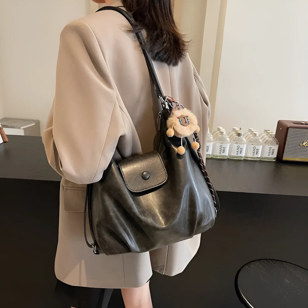 Textured PU leather commuter backpack with horizontal square design and single shoulder strap