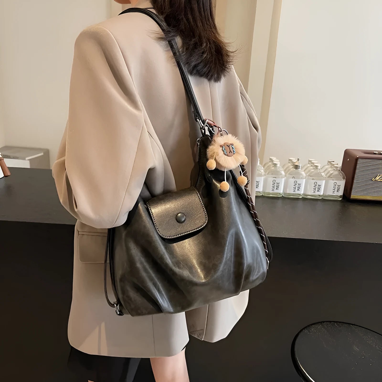 Textured PU leather commuter backpack with horizontal square design and single shoulder strap