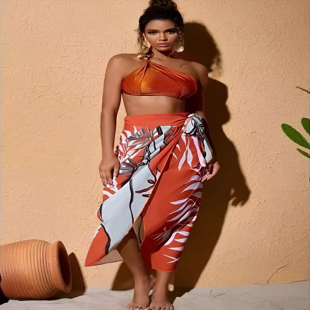 Brown high waisted push up bikini with a sheer split chiffon dress overlay on a mannequin.