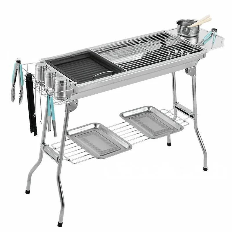 Stainless steel portable barbecue oven with charcoal grills and mesh cooking surfaces