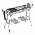 Stainless steel portable barbecue oven with charcoal grills and mesh cooking surfaces