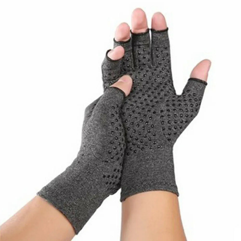 Grey half finger joint compression gloves with anti-slip grip on a hand.