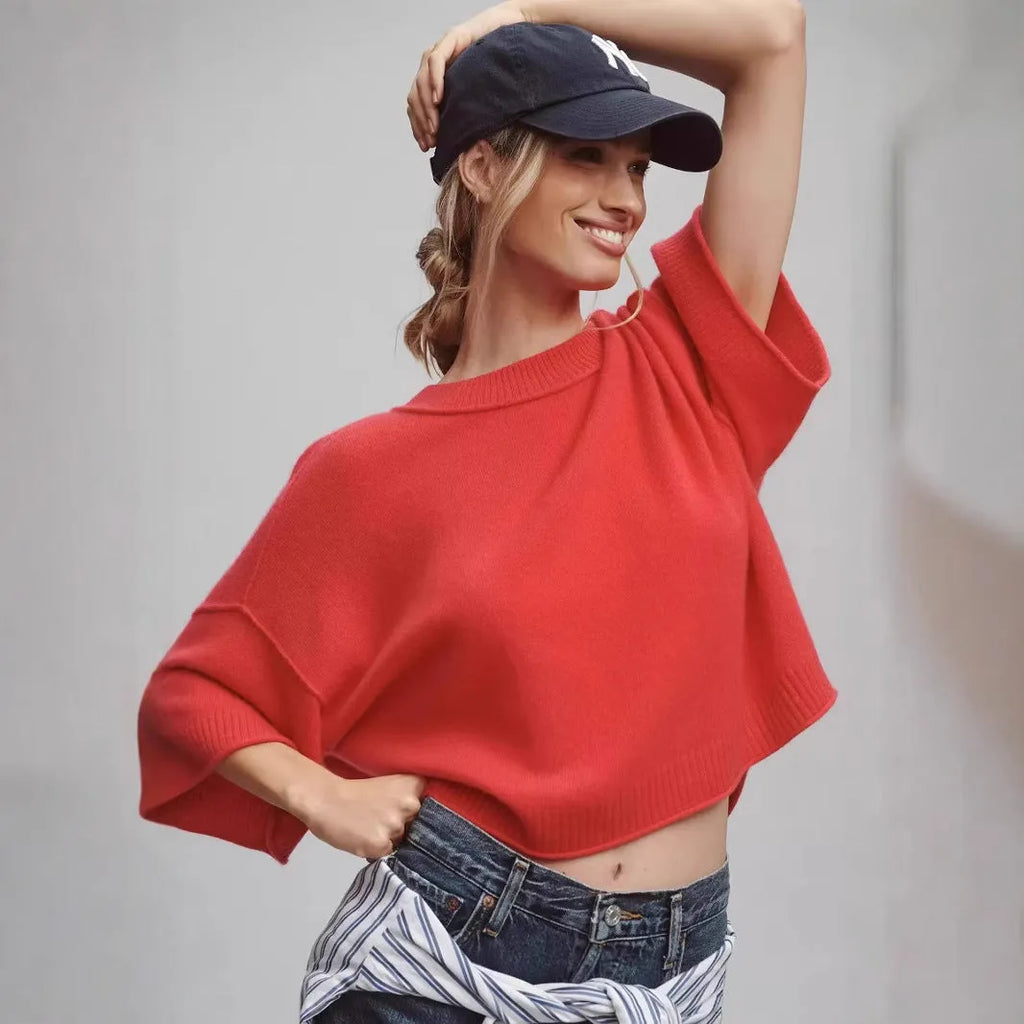 Red short sleeve viscose t-shirt with a cropped, exposed navel hem on a mannequin.