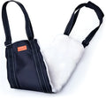 Adjustable dog mobility sling under a dog's hindquarters with reflective nylon straps and a padded liner.