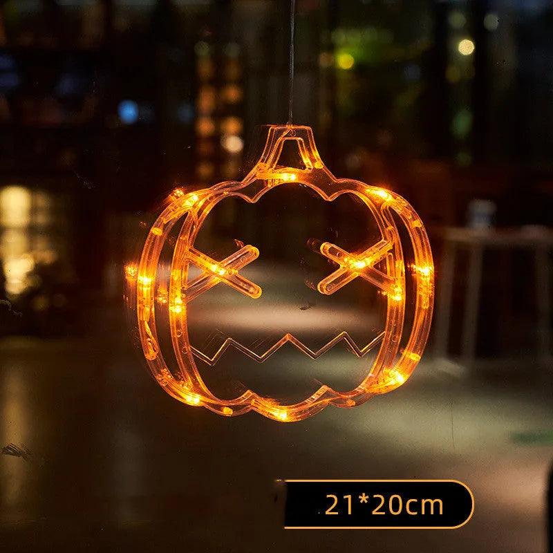 Halloween battery-powered LED window lights with suction cups showing spider, pumpkin and ghost designs