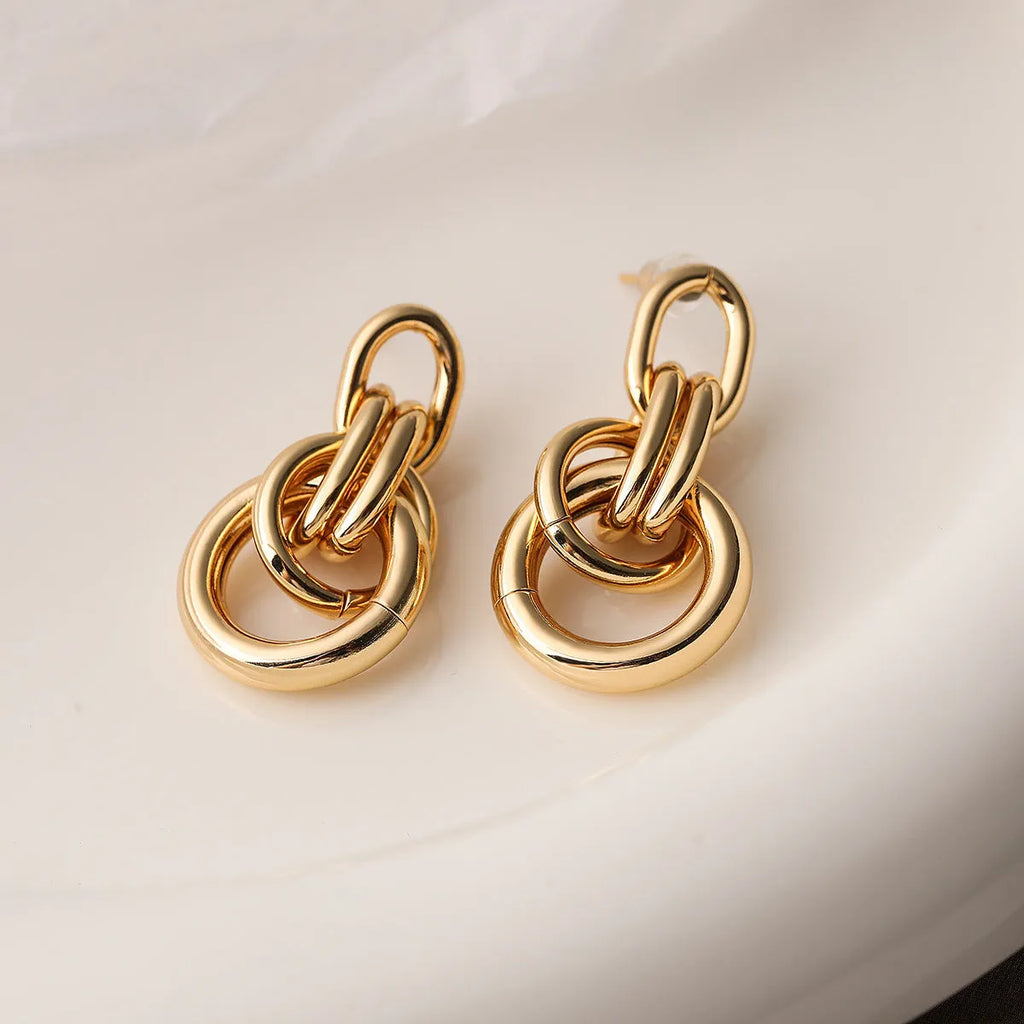 Gold geometric earrings for women with irregular copper shape and simple wild style