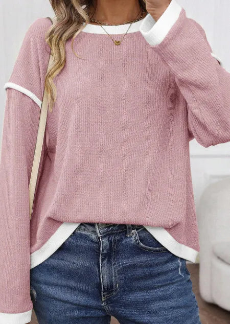 Drop shoulder loose knit top with four leaf clover pattern and contrast colour trim.