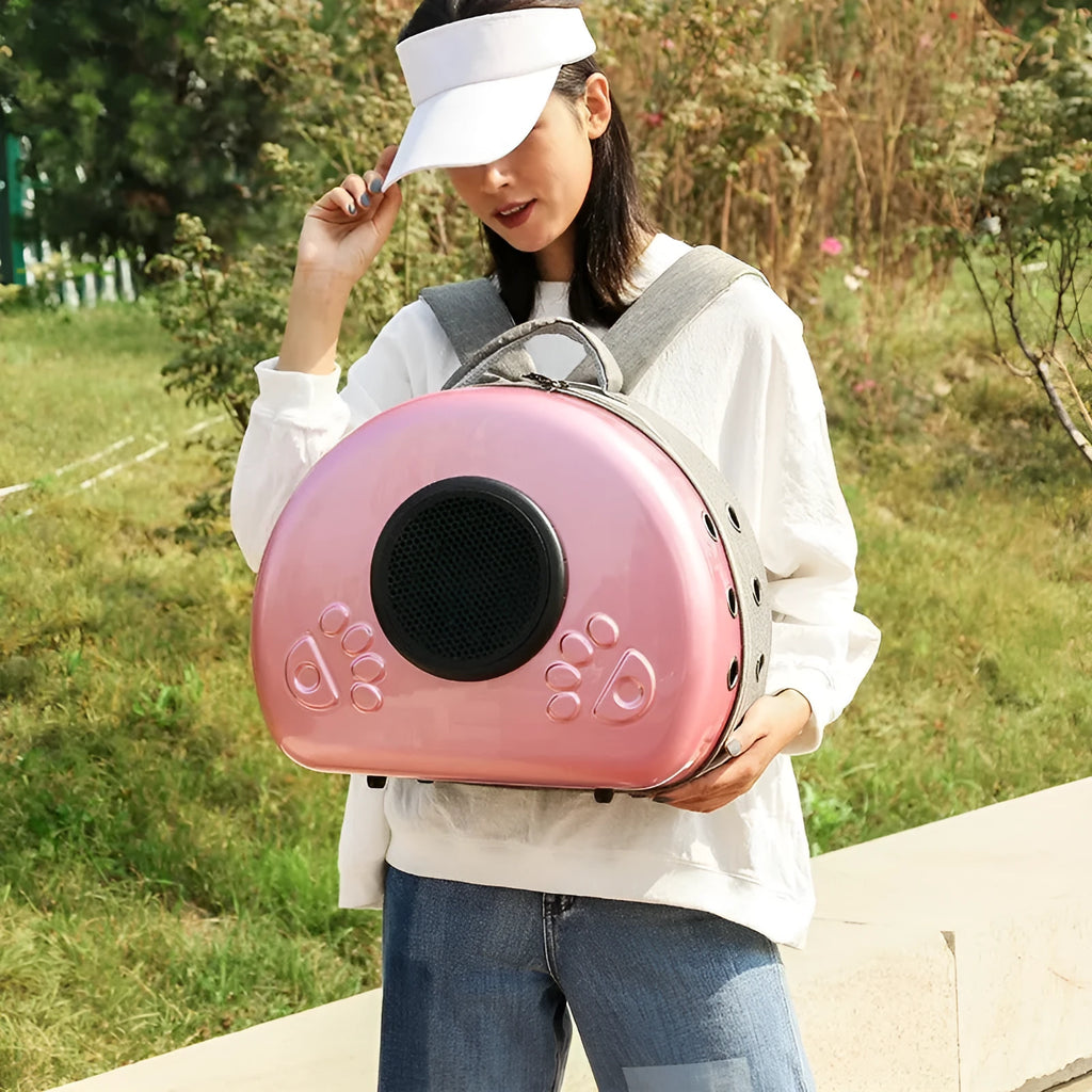 Transparent space capsule style pet carrier bag for cats in a metallic colour with a front shell cover.