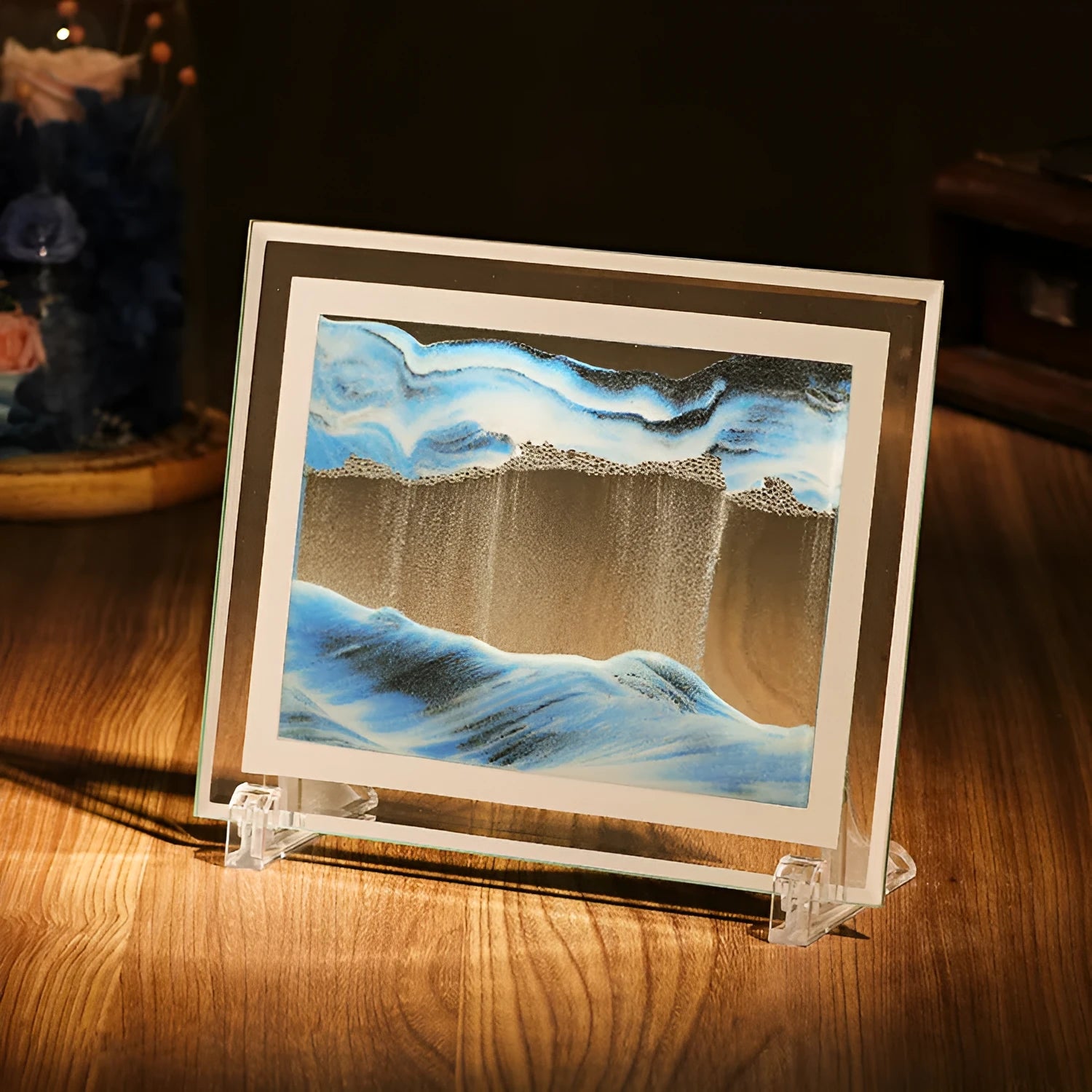 Geometric glass quicksand painting ornament displaying flowing sand patterns