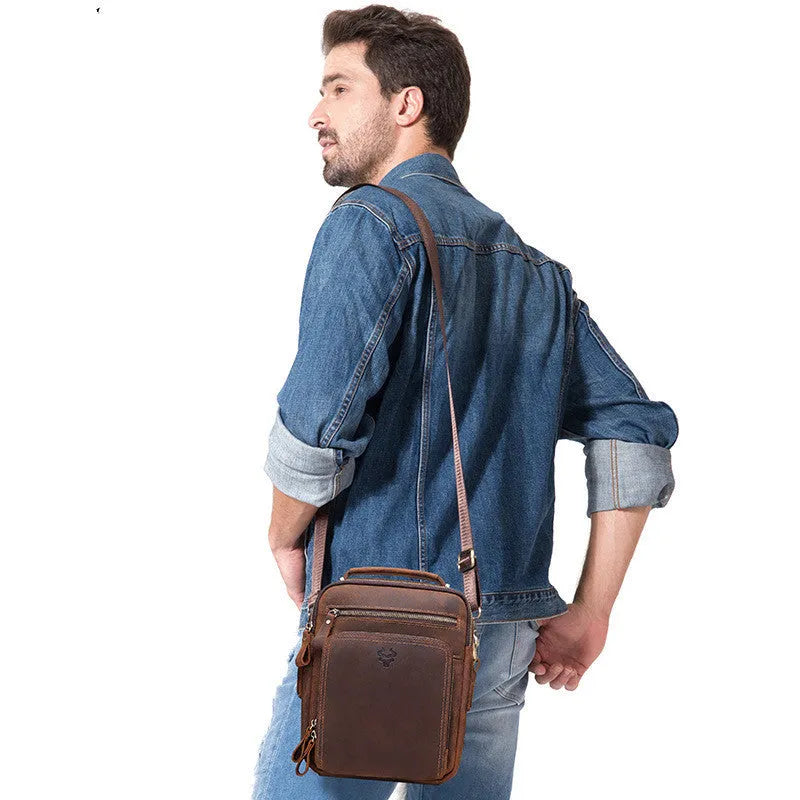 Men's brown Crazy Horse leather single-shoulder crossbody bag with visible sewing lines.