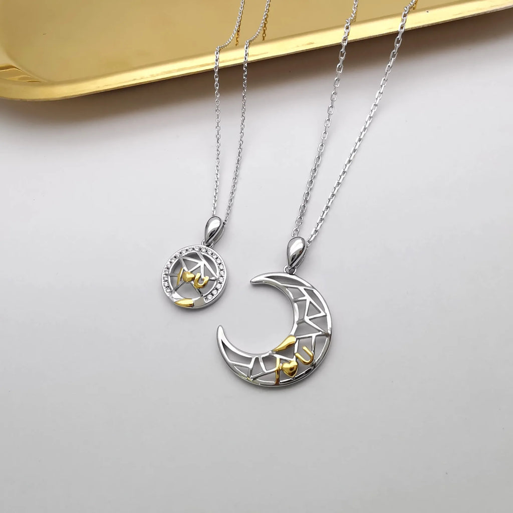 Sun Moon Tooth couple necklace set showing male and female copper pendants on cross chains